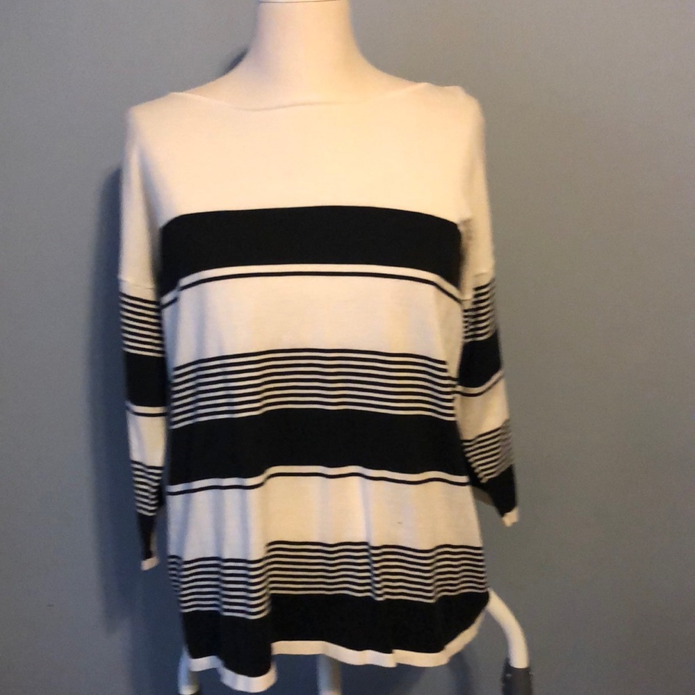 Black and cream thin sweater with tie in back.